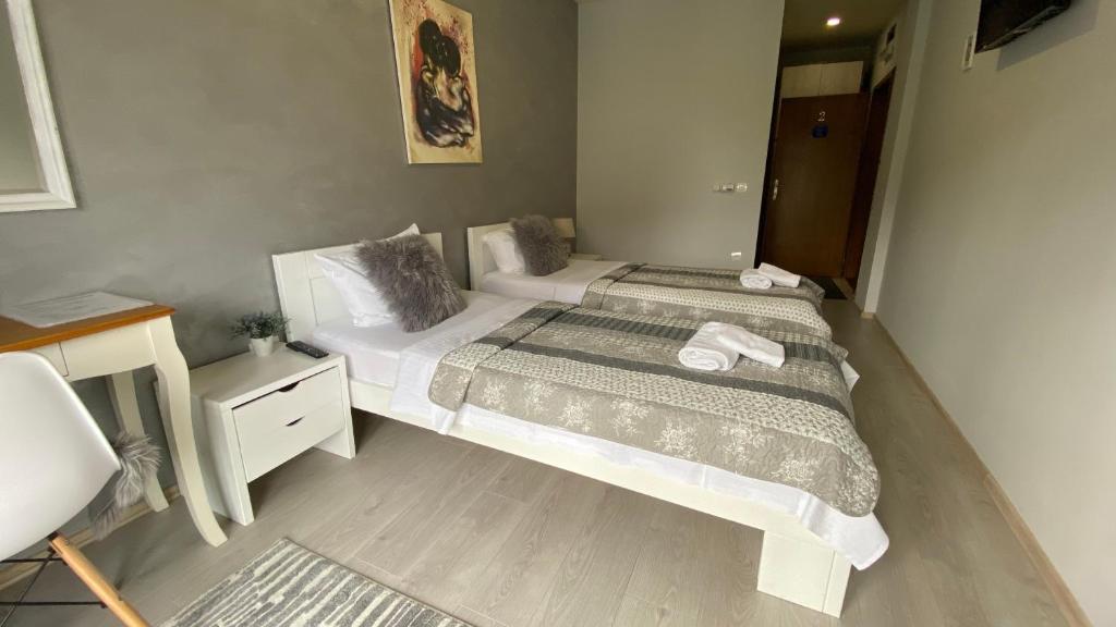 Postel nebo postele na pokoji v ubytování VonAmor Rooms