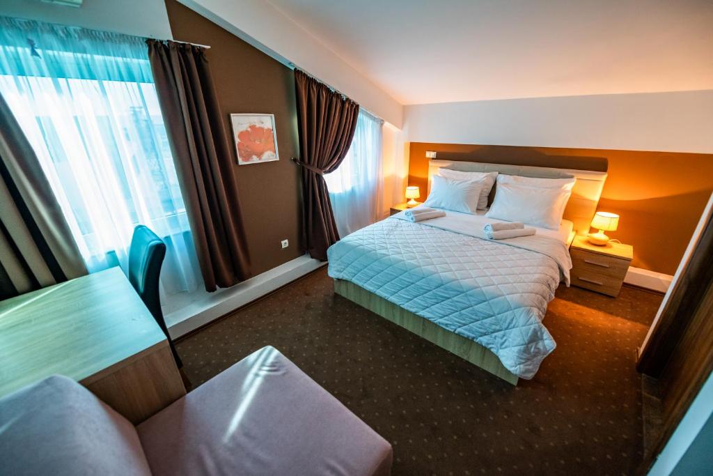 Postel nebo postele na pokoji v ubytování Hotel Oasis