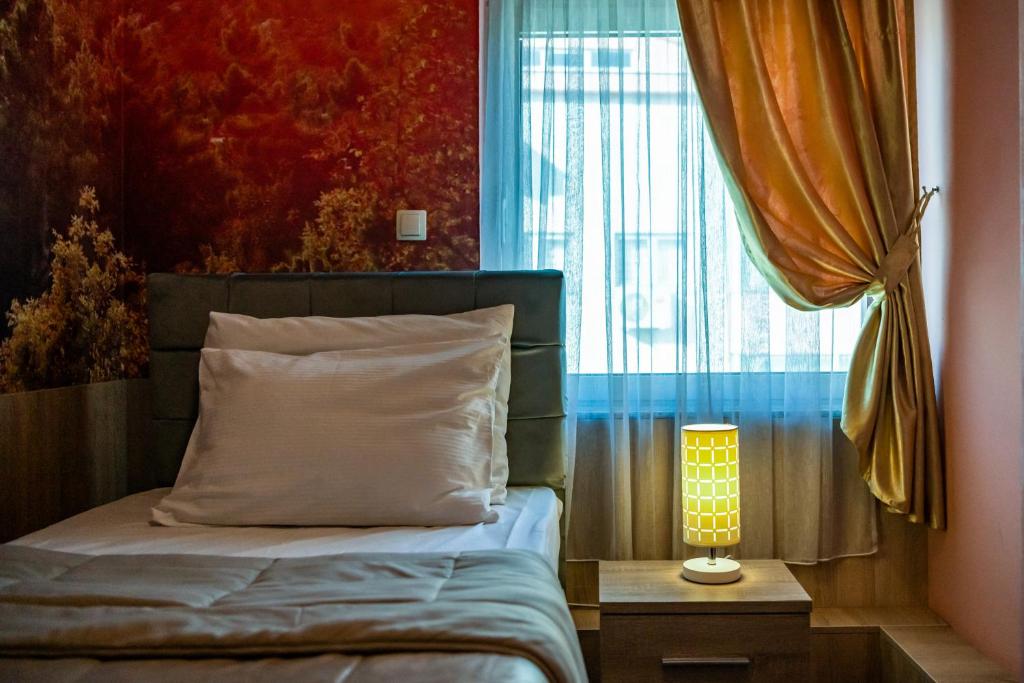 Postel nebo postele na pokoji v ubytování Hotel Oasis