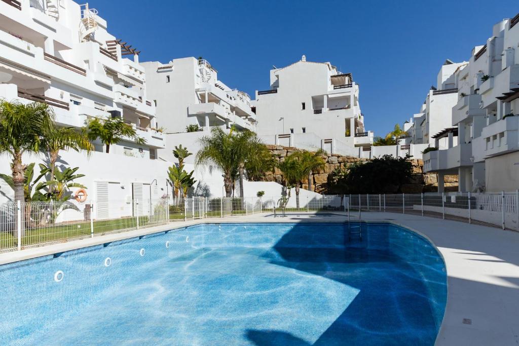 Bazén v ubytovaní Valle Romano Golf Resort Penthouse Apartmento alebo v jeho blízkosti