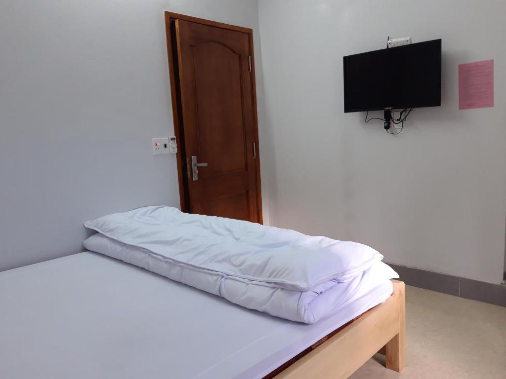 Postel nebo postele na pokoji v ubytování NHÀ NGHỈ T&T