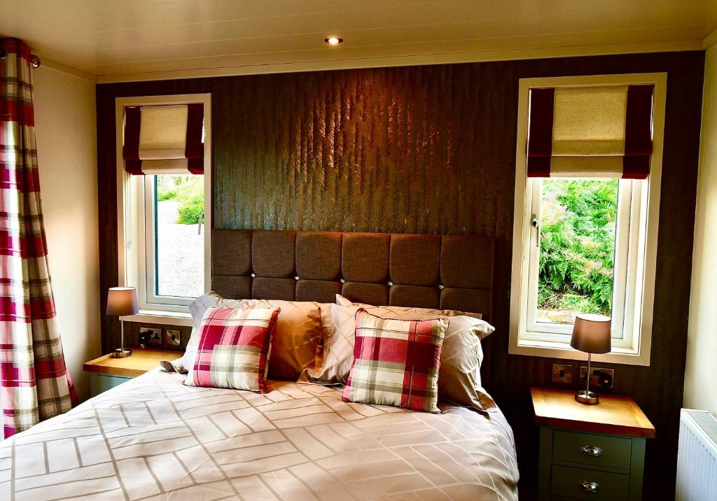 Postel nebo postele na pokoji v ubytování Arbennig Luxury Lodges