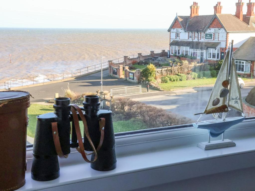 a window sill with a view of the ocean at Sea Spell Loft in Hornsea