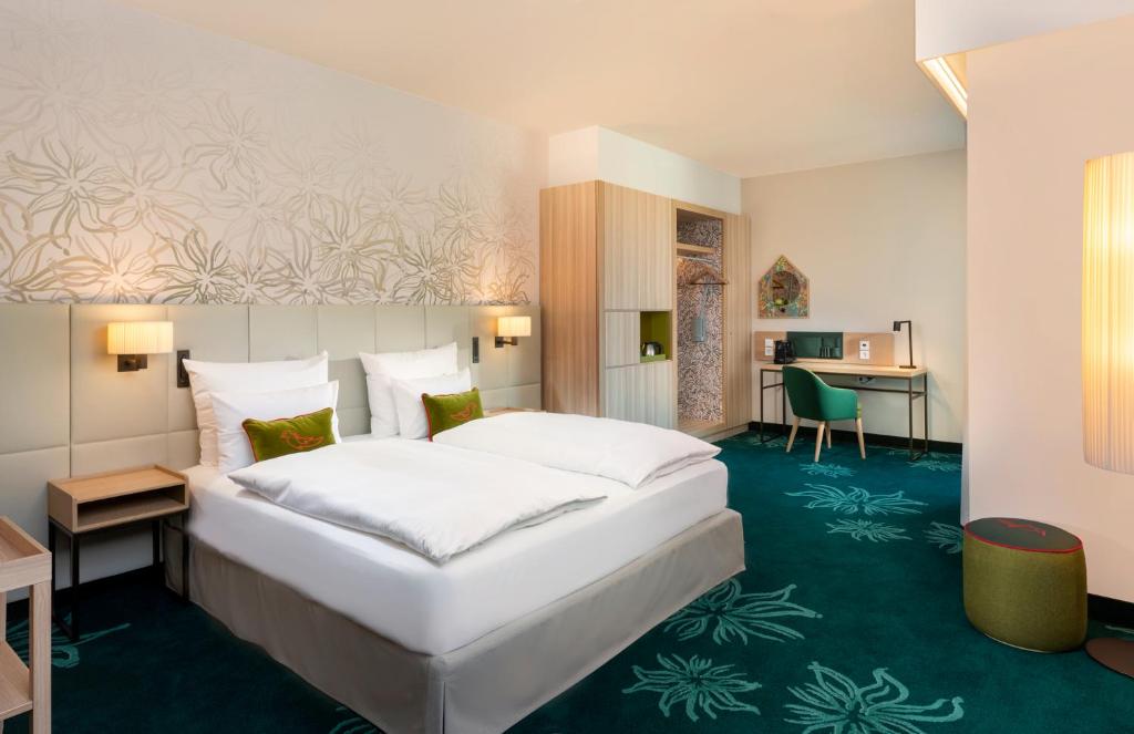 Postel nebo postele na pokoji v ubytování Mövenpick Hotel Stuttgart Messe & Congress