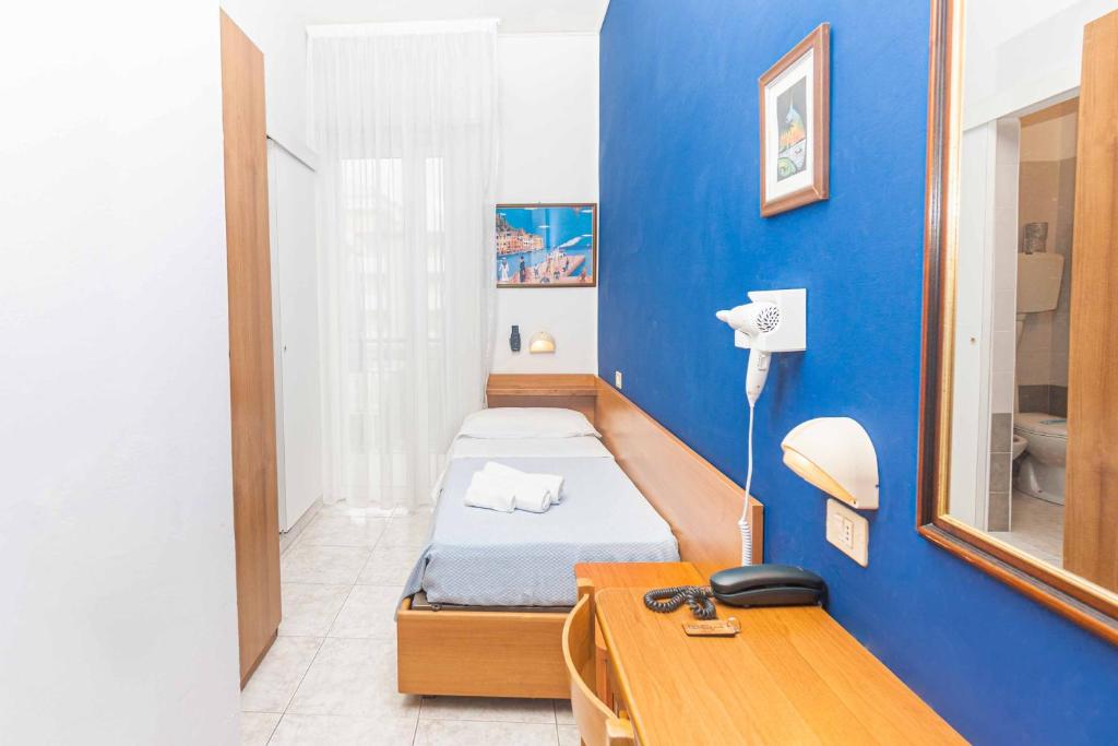 Postel nebo postele na pokoji v ubytování Hotel Arlino