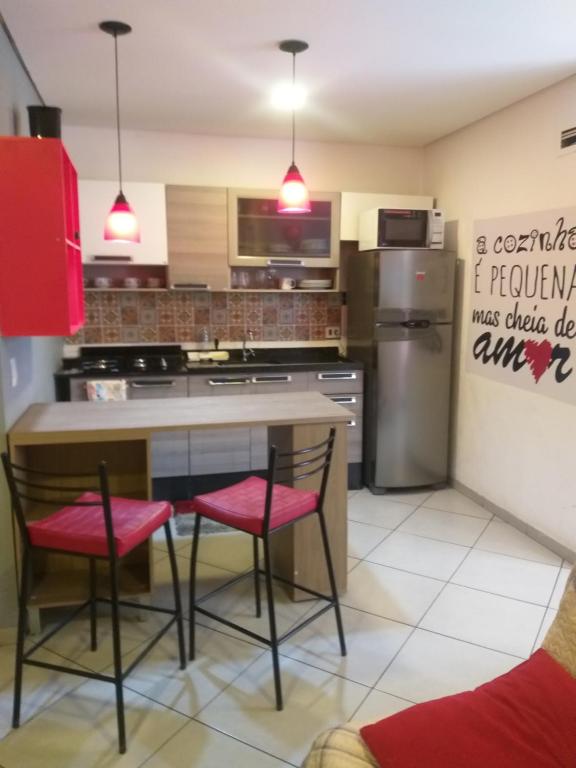 a kitchen with a table and two chairs at Apartamento no centro de São Paulo in Sao Paulo