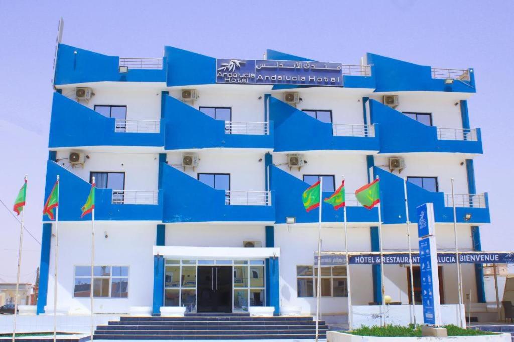 a building with flags in front of it at Andalusia Hotel in Nouakchott