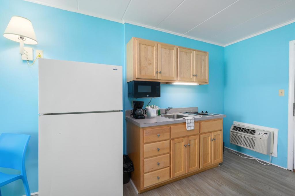 Kuchyň nebo kuchyňský kout v ubytování Kokomo Suites