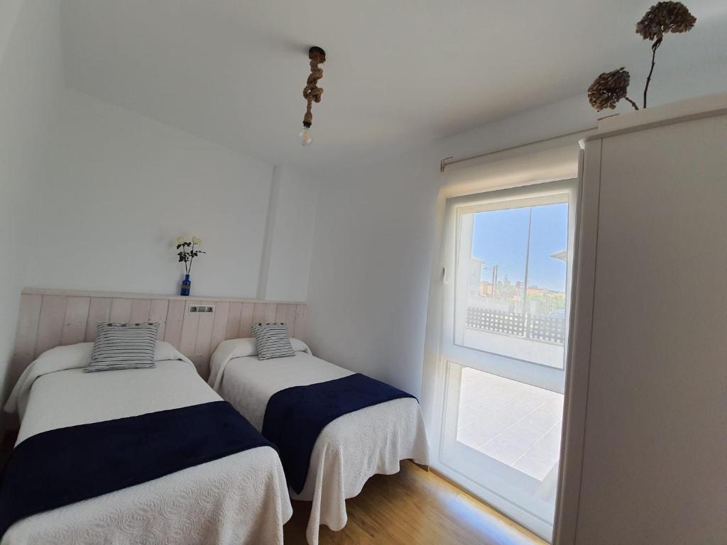 A bed or beds in a room at El Rincón de Gabriela