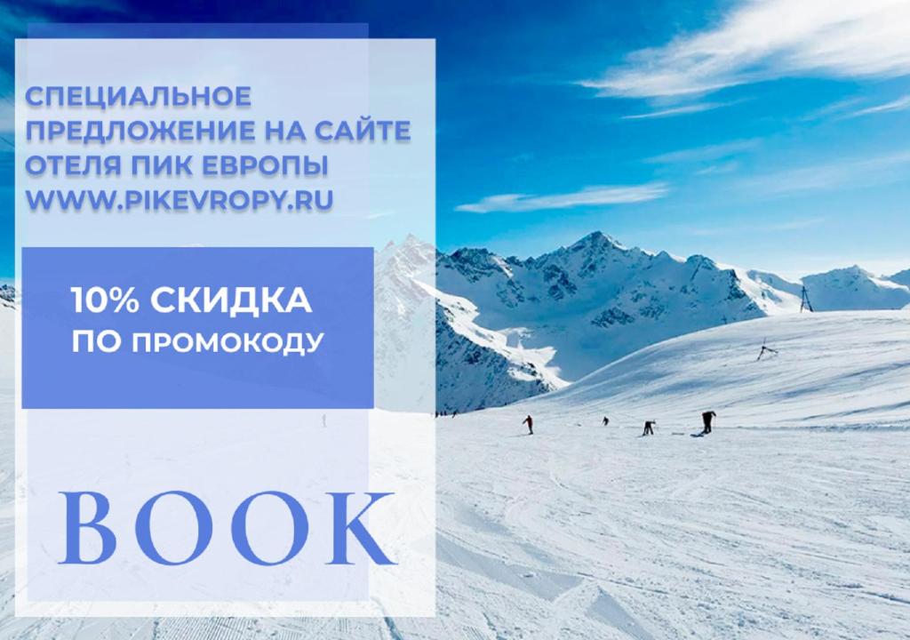 a brochure for a ski resort with people skiing down a mountain at Pik Evropi in Tegenekli