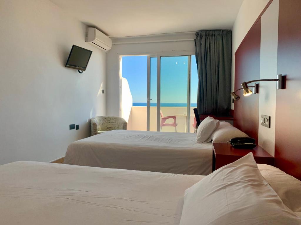 Postel nebo postele na pokoji v ubytování Hospedium Hotel Continental
