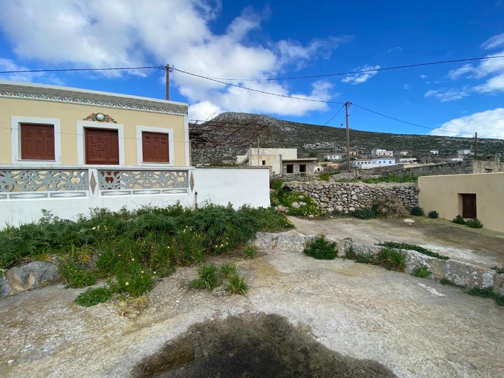 a house with a hill in the background at LoView Avlona 