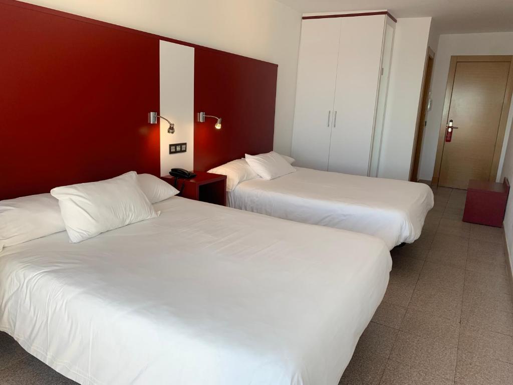 Postel nebo postele na pokoji v ubytování Hospedium Hotel Continental