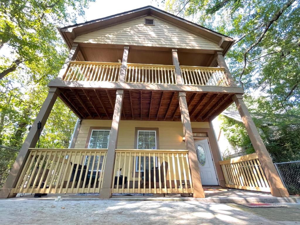 a house with a large porch with a deck at Sweet Home Atlanta in Atlanta