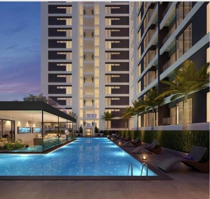 an image of a building with a swimming pool at Astoria 2BR Penthouse [Views of Bliss] in Nairobi