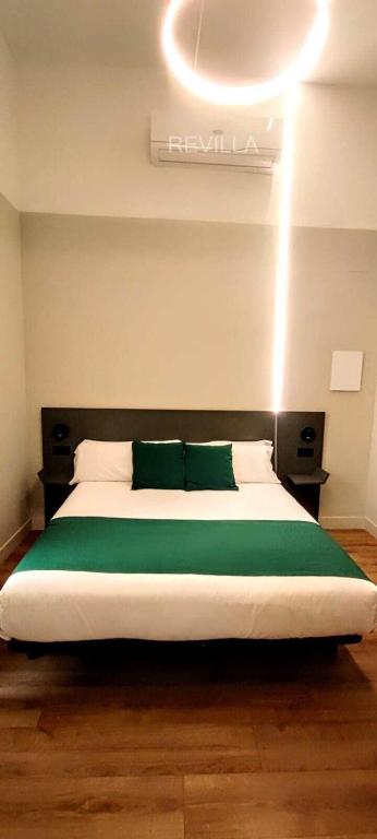 Postel nebo postele na pokoji v ubytování Hostal Anton Martin