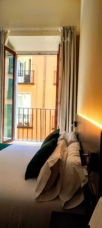 Postel nebo postele na pokoji v ubytování Hostal Anton Martin