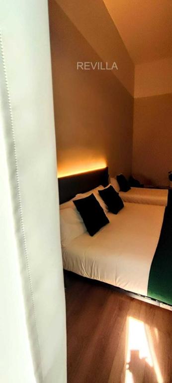 Postel nebo postele na pokoji v ubytování Hostal Anton Martin