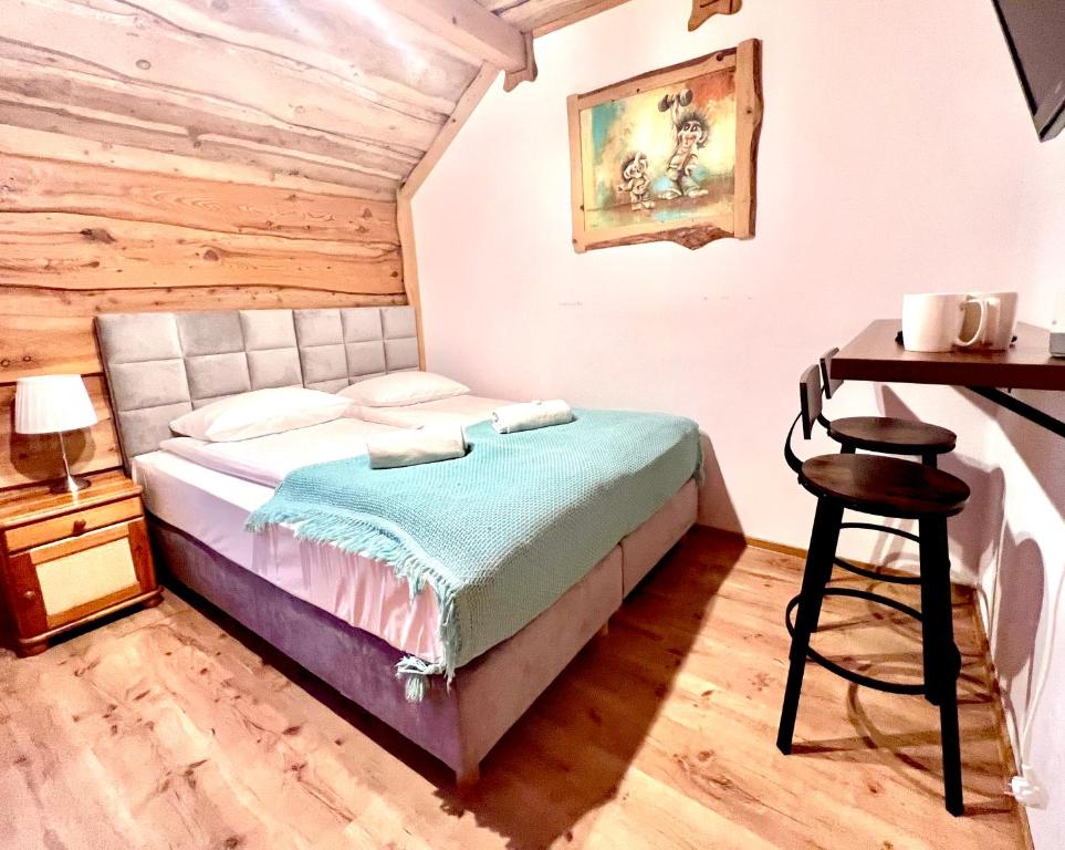 Łóżko lub łóżka w pokoju w obiekcie Troll