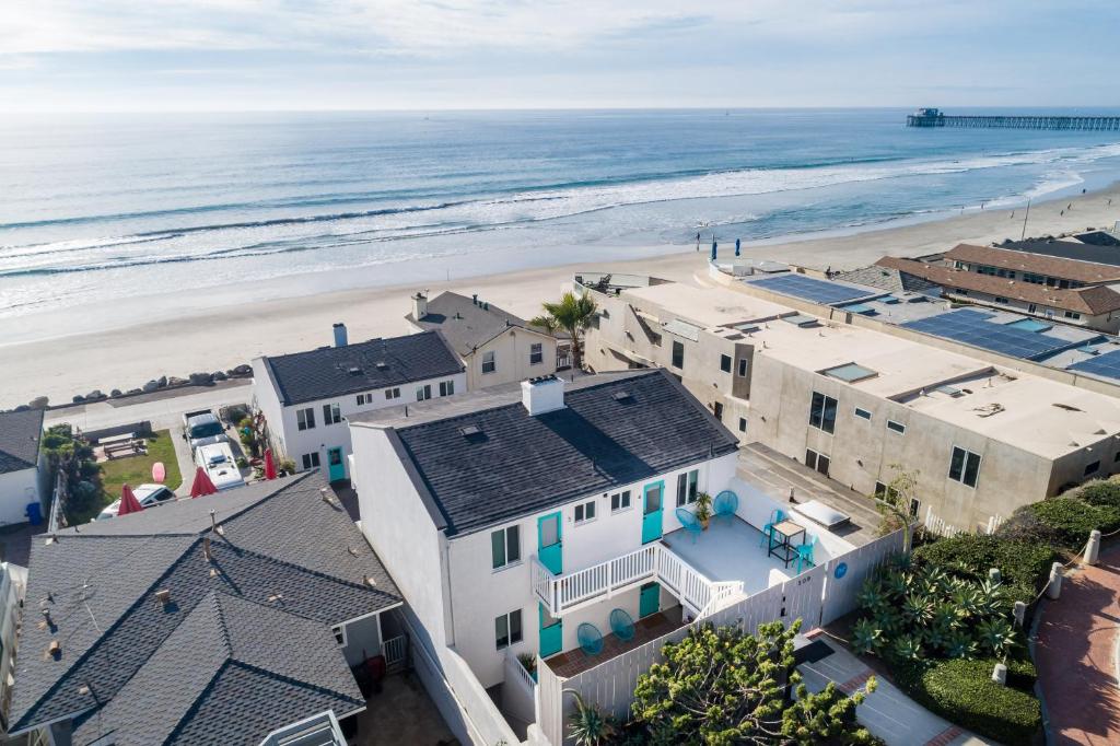 an aerial view of the beach and buildings at Pacific Villas in Oceanside