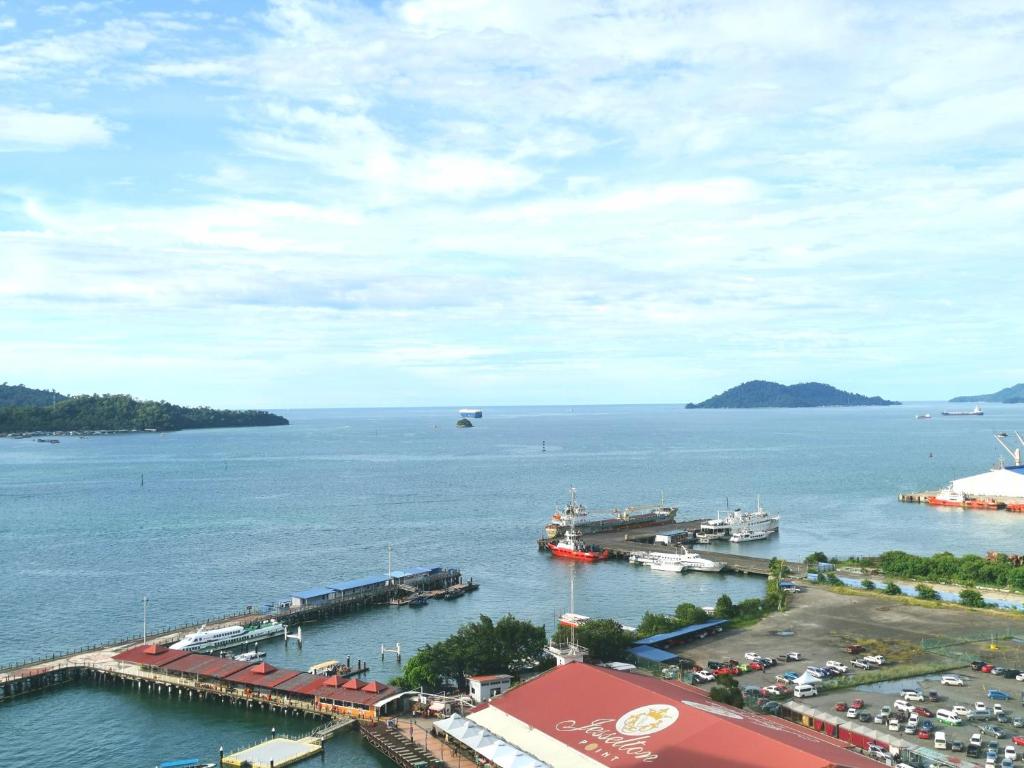 a view of a harbor with boats in the water at M Centro City Centre @ Gaya Street by Sunset Seaview Vacation Condos in Kota Kinabalu