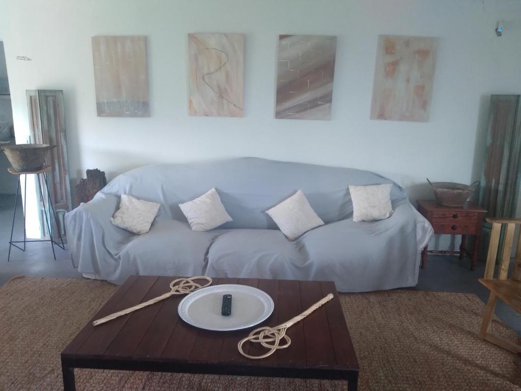 a living room with a couch and a table at Sierras de Paz in Villa Giardino