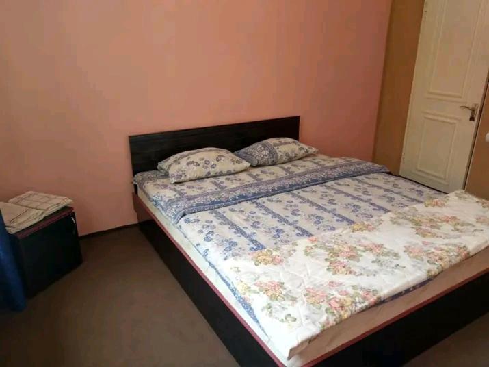 Postel nebo postele na pokoji v ubytování Sevan Garden Complex