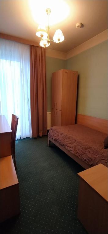Postel nebo postele na pokoji v ubytování Hotel Pasymowski
