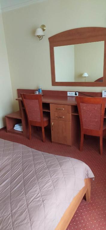 Postel nebo postele na pokoji v ubytování Hotel Pasymowski