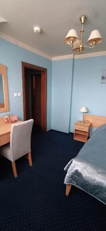 Postel nebo postele na pokoji v ubytování Hotel Pasymowski