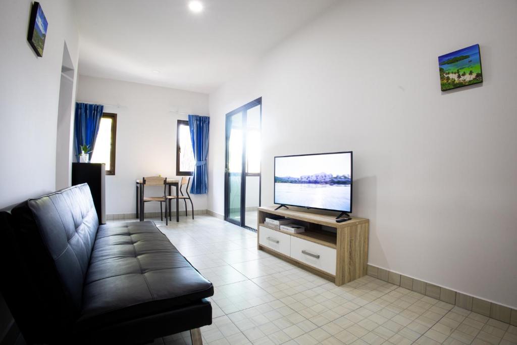 Televízia a/alebo spoločenská miestnosť v ubytovaní Grand View Premium