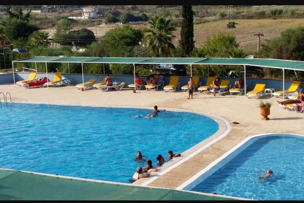 a group of people in a swimming pool at Summer Villa with pools, beach area, free sun loungers and free car park in Side