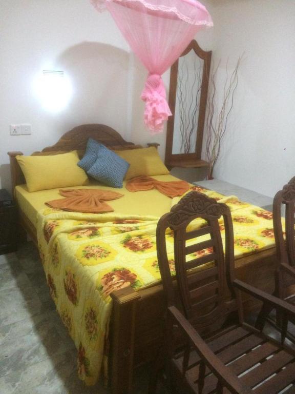 Postel nebo postele na pokoji v ubytování Nimsara Homestay