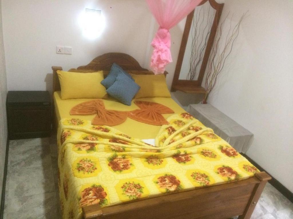 Postel nebo postele na pokoji v ubytování Nimsara Homestay