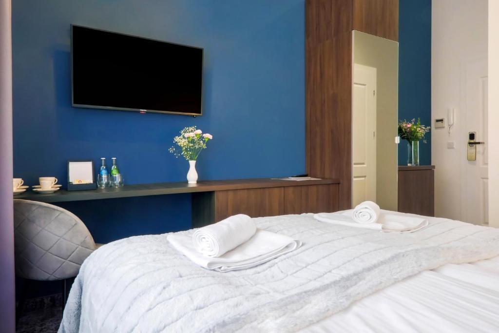 Posteľ alebo postele v izbe v ubytovaní Aparthotel Cracovia Residence