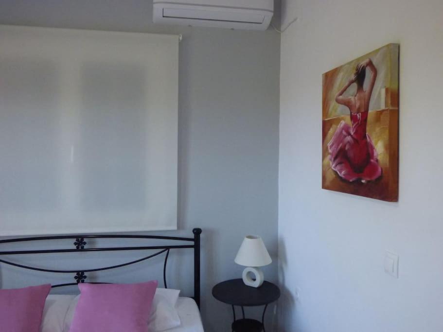 Postel nebo postele na pokoji v ubytování AGIOS LEON APARTMENT 1