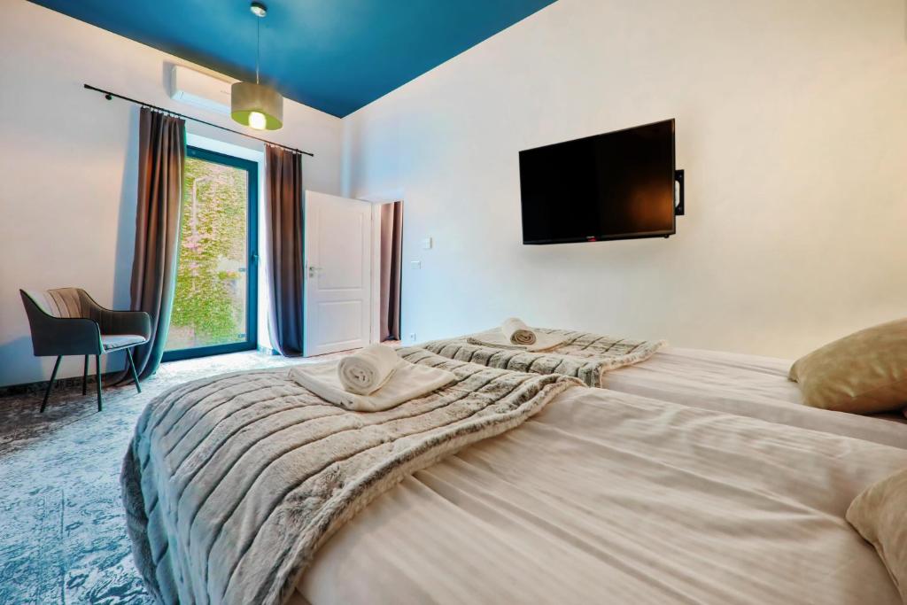 Posteľ alebo postele v izbe v ubytovaní Aparthotel Cracovia Residence