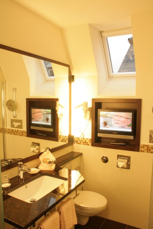Ein Badezimmer in der Unterkunft Hotel Haus Berlin
