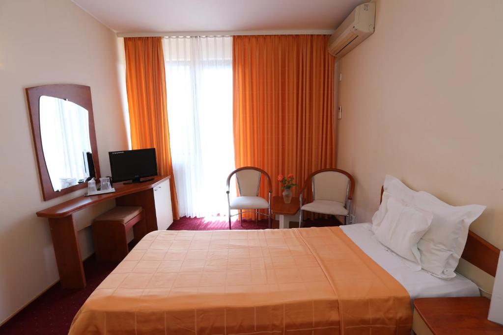 Postel nebo postele na pokoji v ubytování Hotel Doina