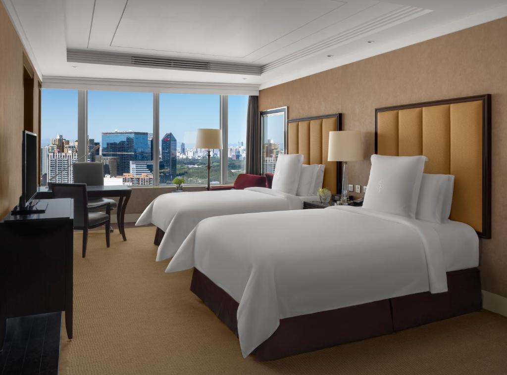 Postel nebo postele na pokoji v ubytování Four Seasons Hotel Beijing