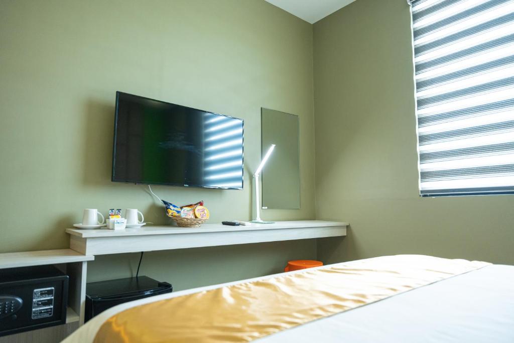 Katil atau katil-katil dalam bilik di Felicity Island Hotel