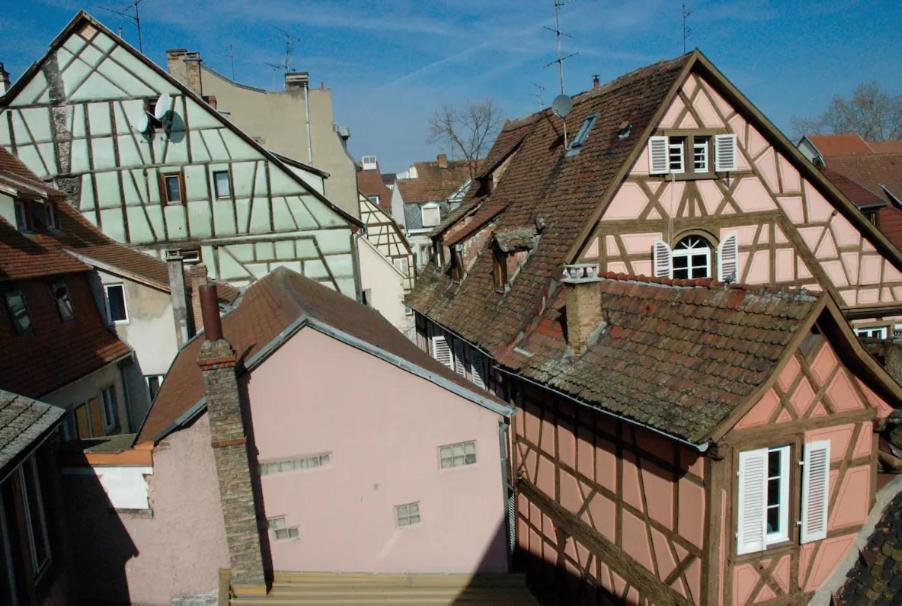 a group of old buildings in a city at Bretzel &amp; Raisin - Hypercentre de Colmar in Colmar