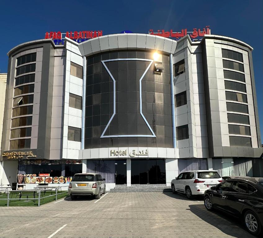 a large building with a large t sign on it at AFAQ AL BATINAH - SAHAM in Şaḩam