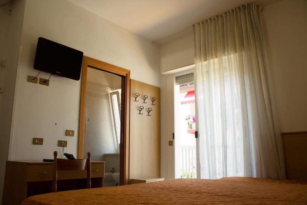 TV a/nebo společenská místnost v ubytování Hotel Kennedy