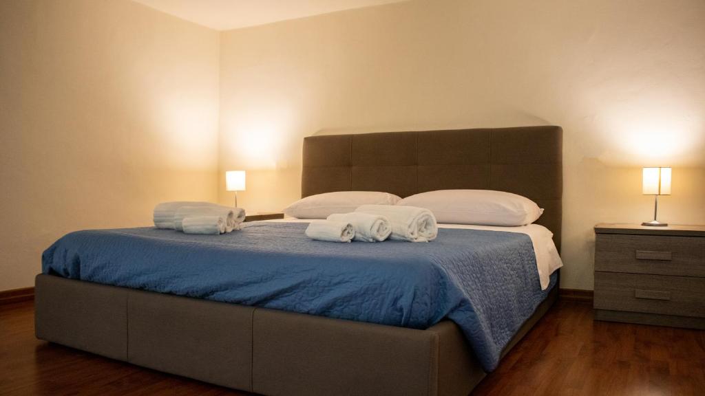 Postel nebo postele na pokoji v ubytování Apollo Suites