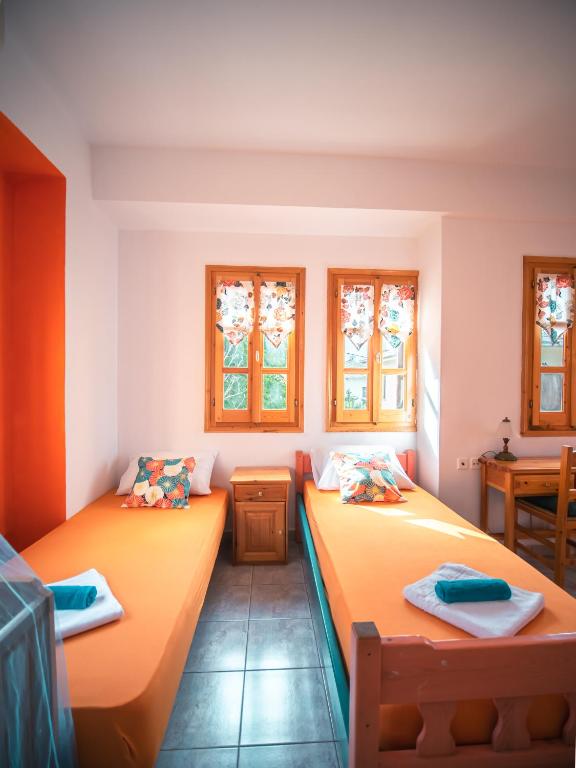 Posteľ alebo postele v izbe v ubytovaní Orange House for big families in Damouchari - Delicious Houses