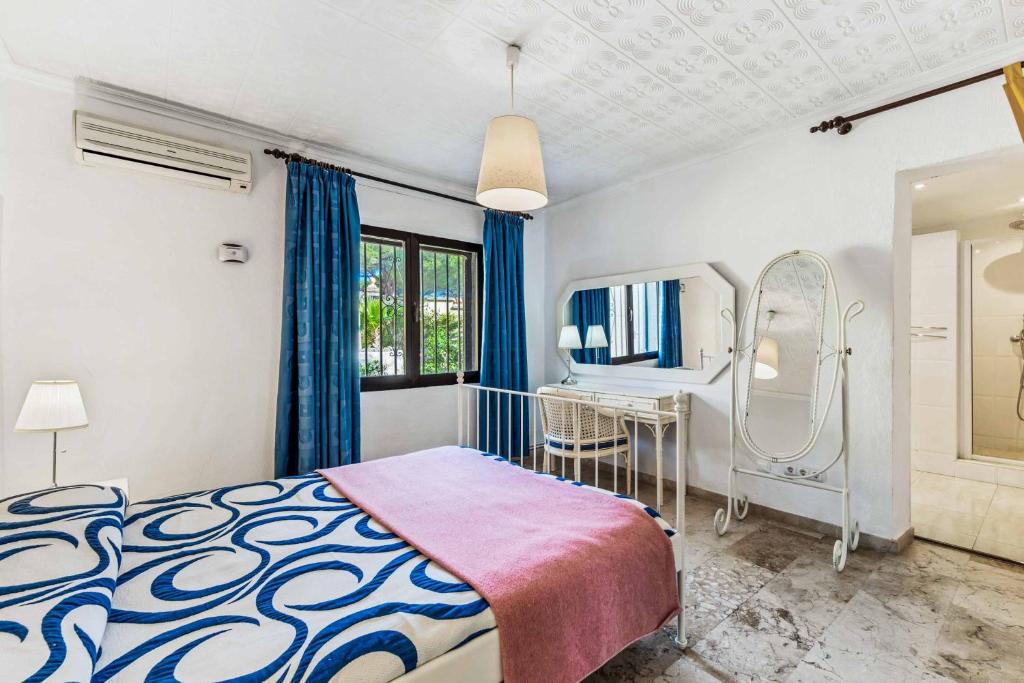 Postel nebo postele na pokoji v ubytování Villa Flores