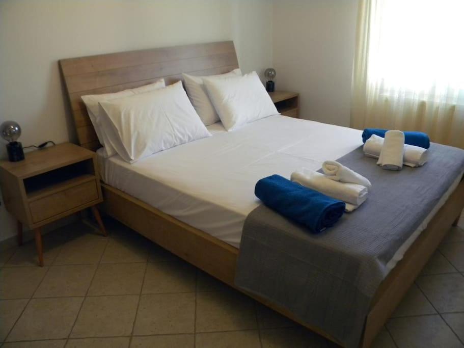 A bed or beds in a room at Casa Karavola in Galanado village-Naxos