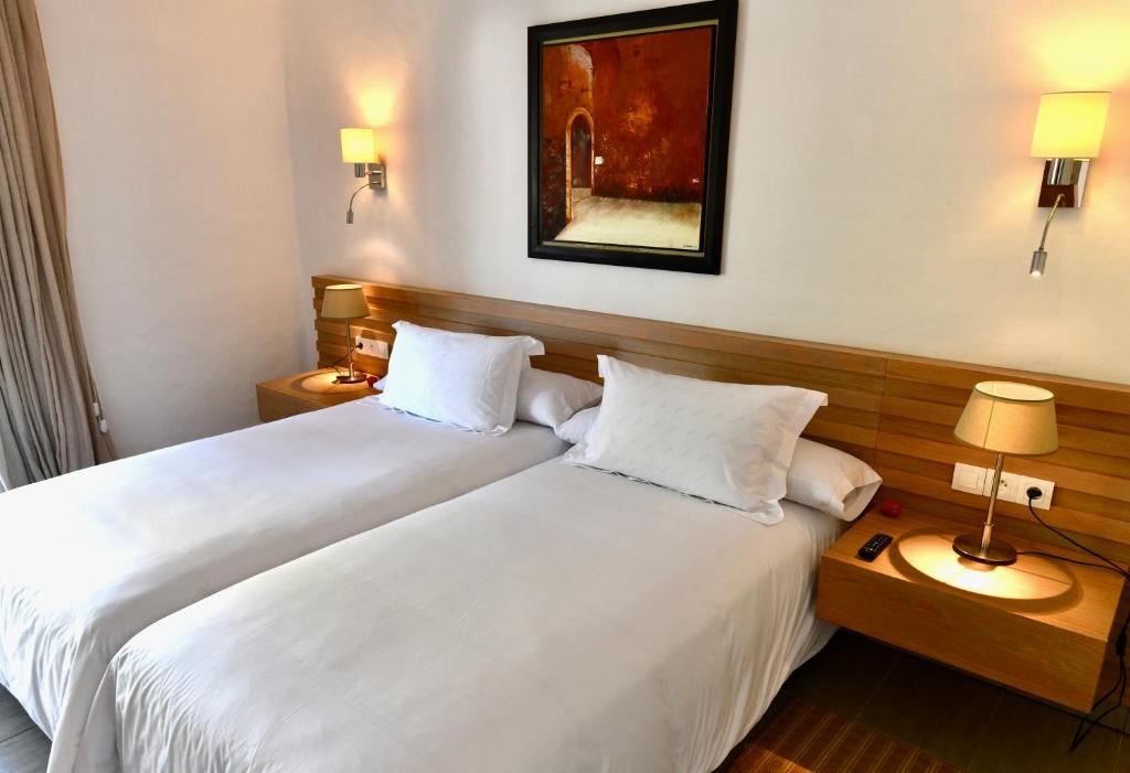 Ένα ή περισσότερα κρεβάτια σε δωμάτιο στο Hotel Kabila
