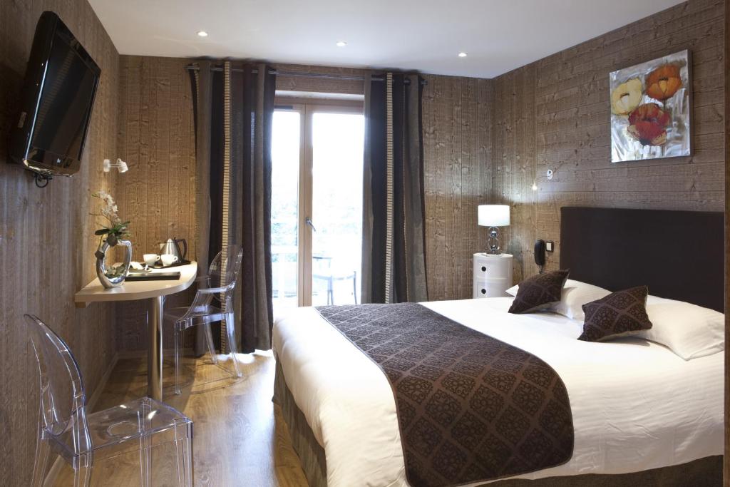 Postel nebo postele na pokoji v ubytování Hotel Blanc